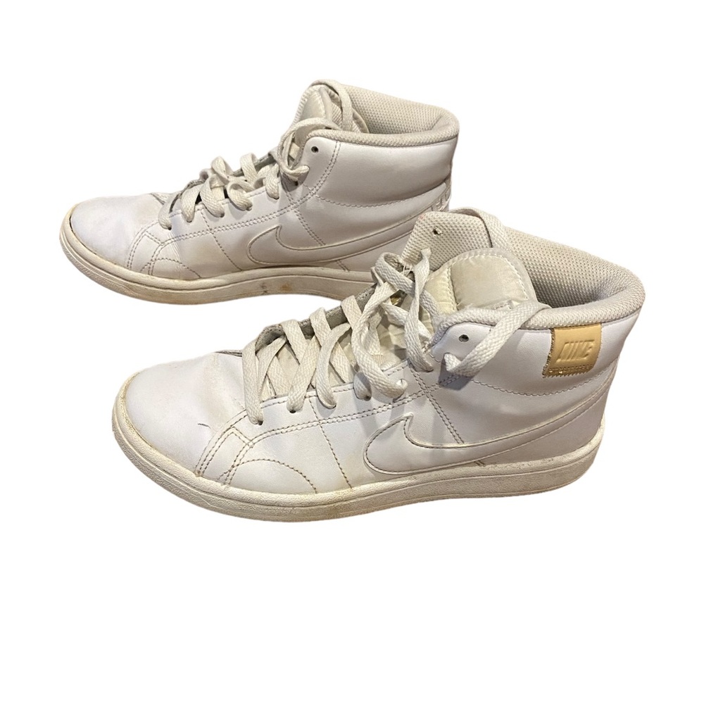 All white NIKe high tops